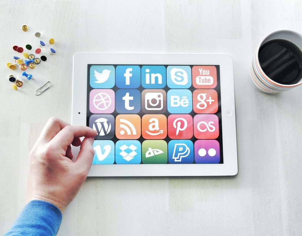 logos of social media platforms on tablet